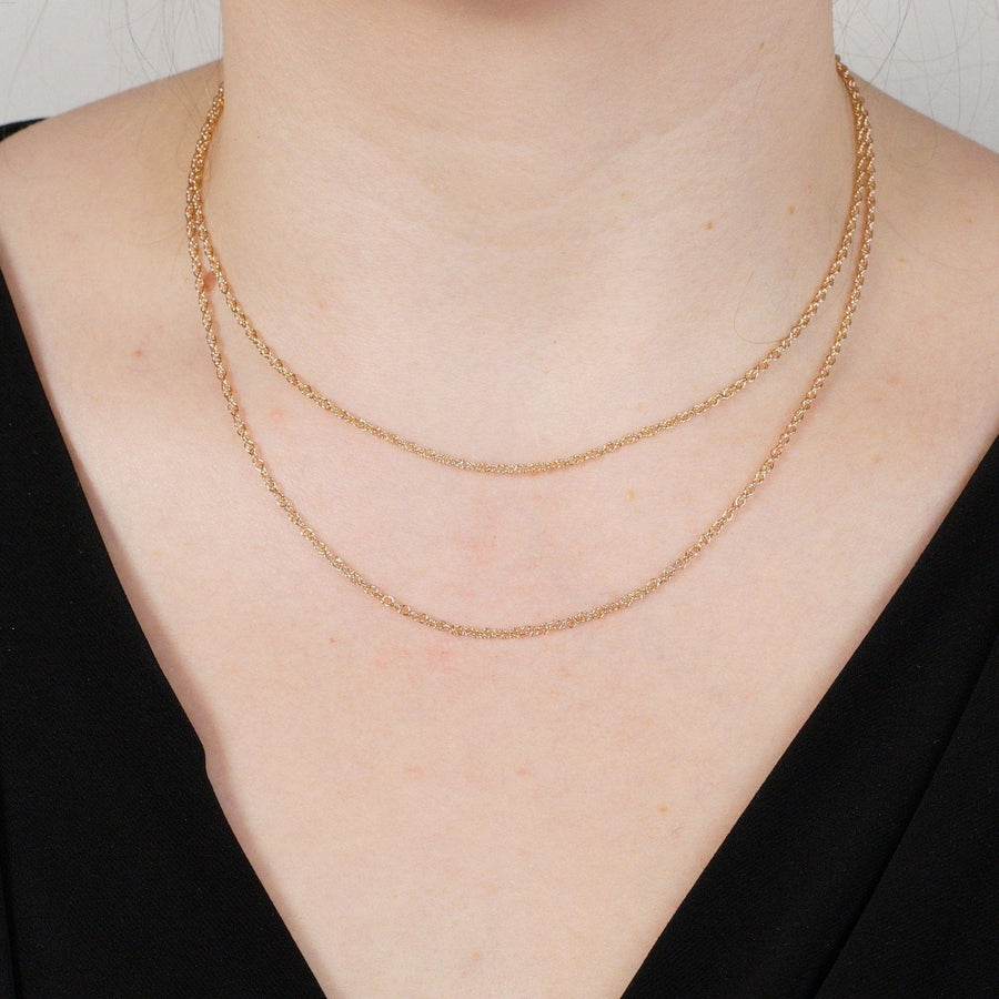 Two-layered 9ct rose gold Prince of Wales rope chain worn on a model's neck, showcasing its elegant design.