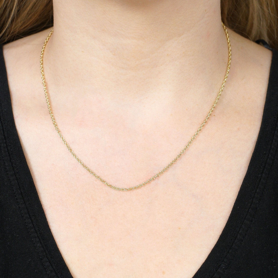 9ct yellow gold Prince of Wales rope chain worn by model, 18" length, showcasing classic chain design.