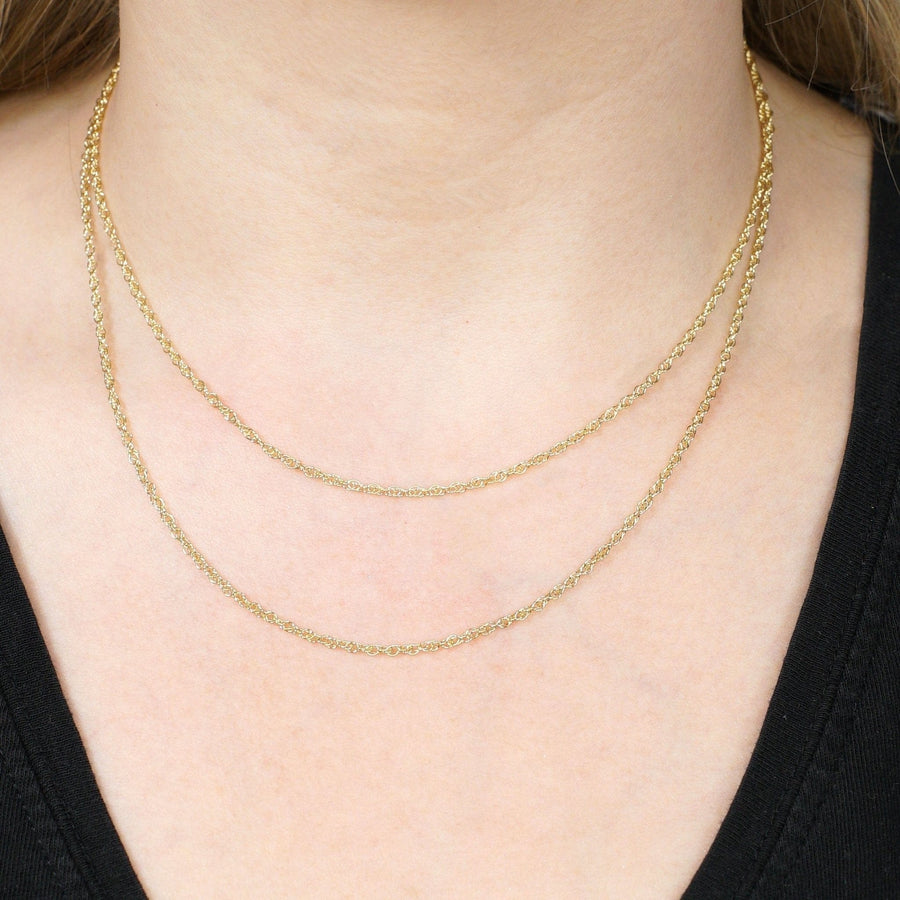 Contemporary 9ct yellow gold Prince of Wales rope chain worn on neck, showcasing dual layers and fine craftsmanship.