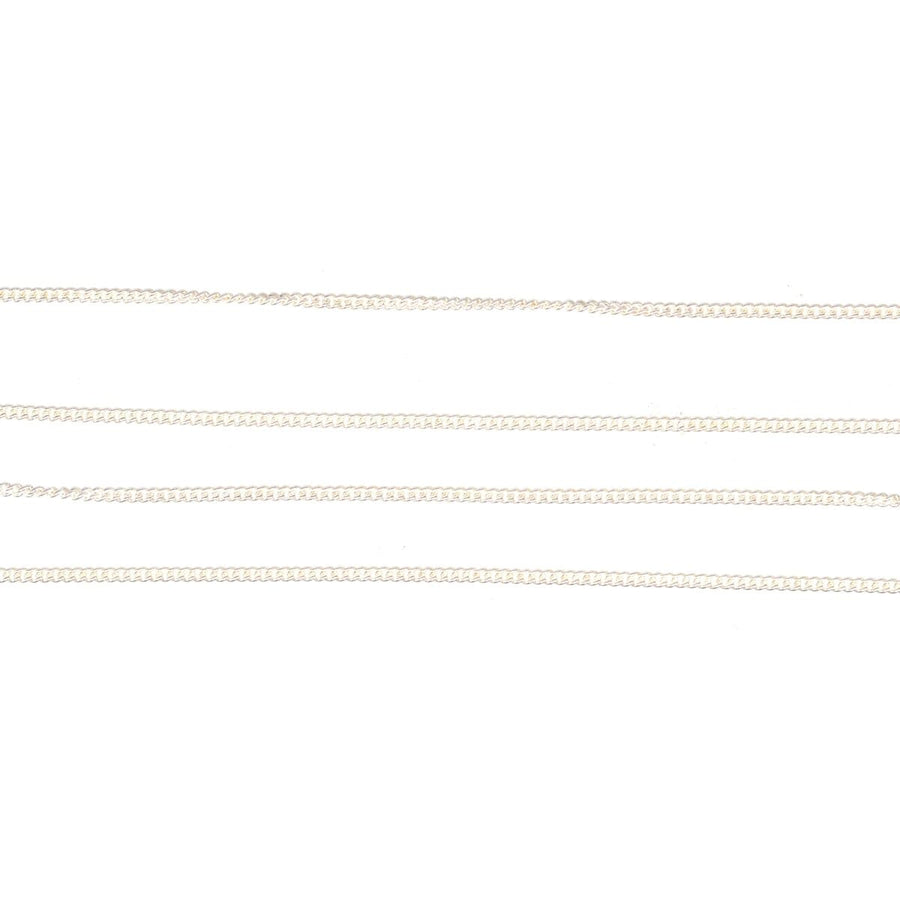 Contemporary silver curb chain in multiple lengths, showcasing fine polish and classic design, suitable for everyday wear.