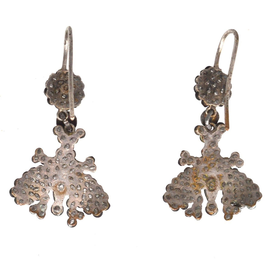 Early 19th century cut steel butterfly earrings, shimmering with antique elegance and intricate craftsmanship.