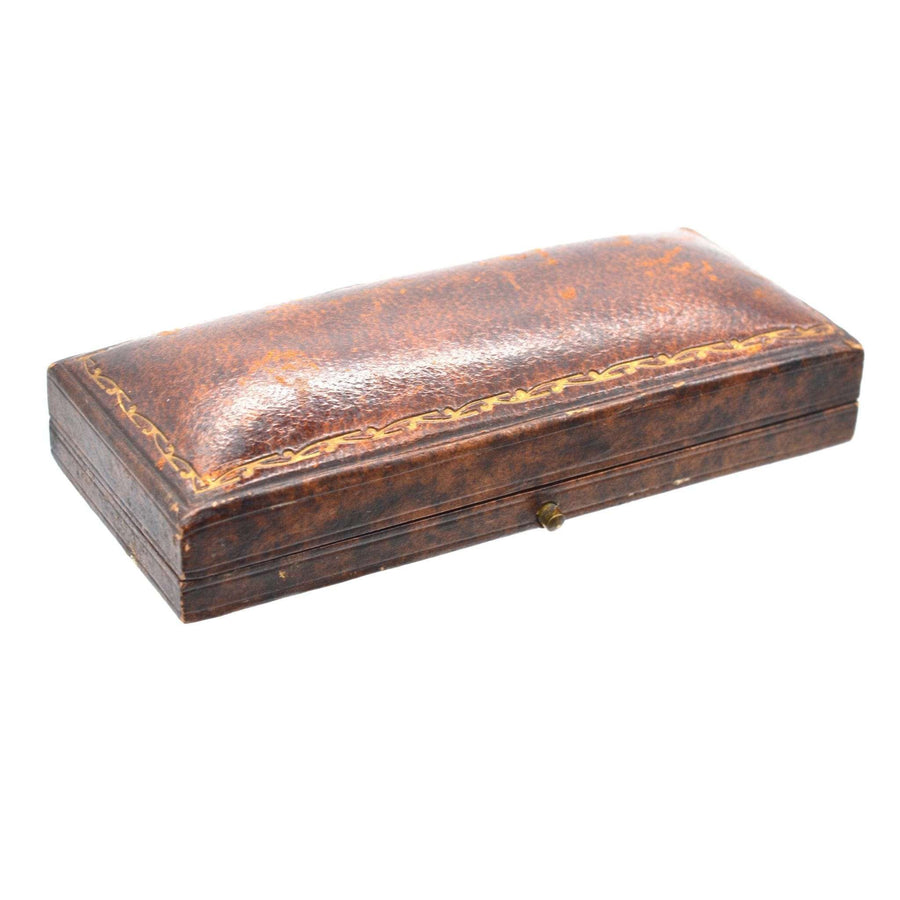 Vintage leather case for Early Georgian Stuart crystal cufflinks, showcasing intricate detailing and classic design.