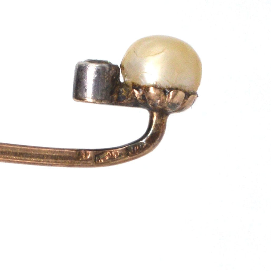 Edwardian 14ct gold tie pin featuring a lustrous natural pearl and a sparkling diamond, ideal for silk ties.