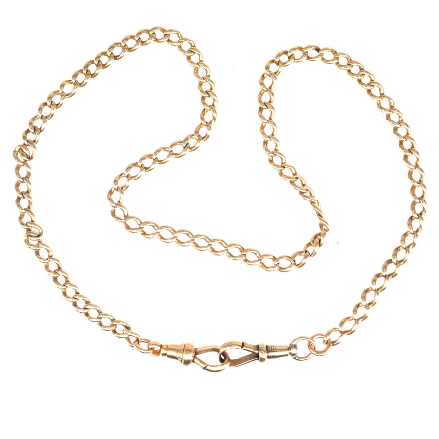 Edwardian 15ct gold Albert chain necklace with dog clips, showcasing intricate links and a classic design.
