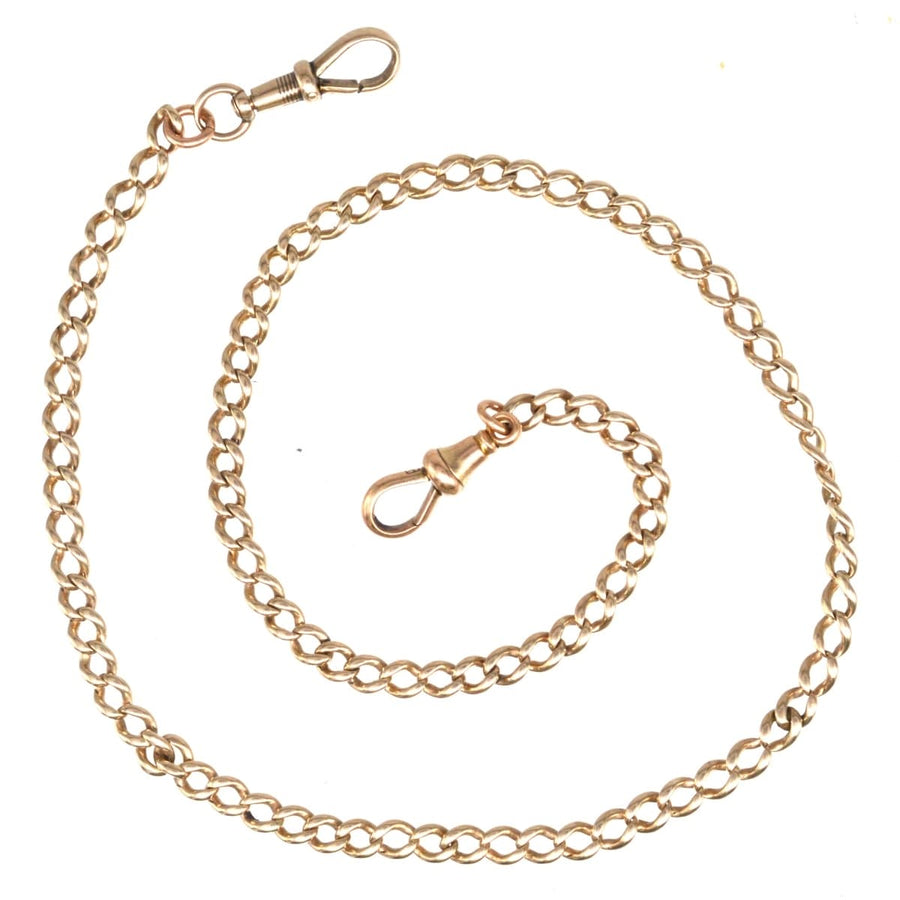 Edwardian 15ct gold Albert chain necklace with dog clips, featuring linked design and clasps for secure wear.