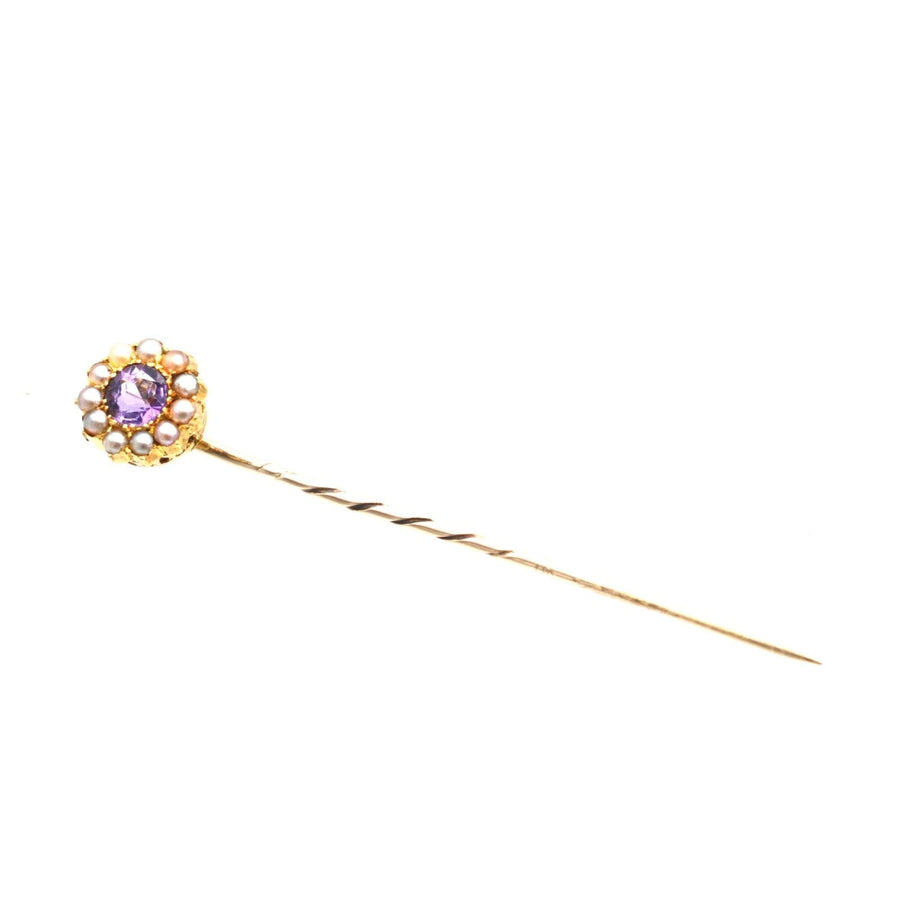 Edwardian 15ct gold stickpin with amethyst and pearl cluster, showcasing fine craftsmanship.