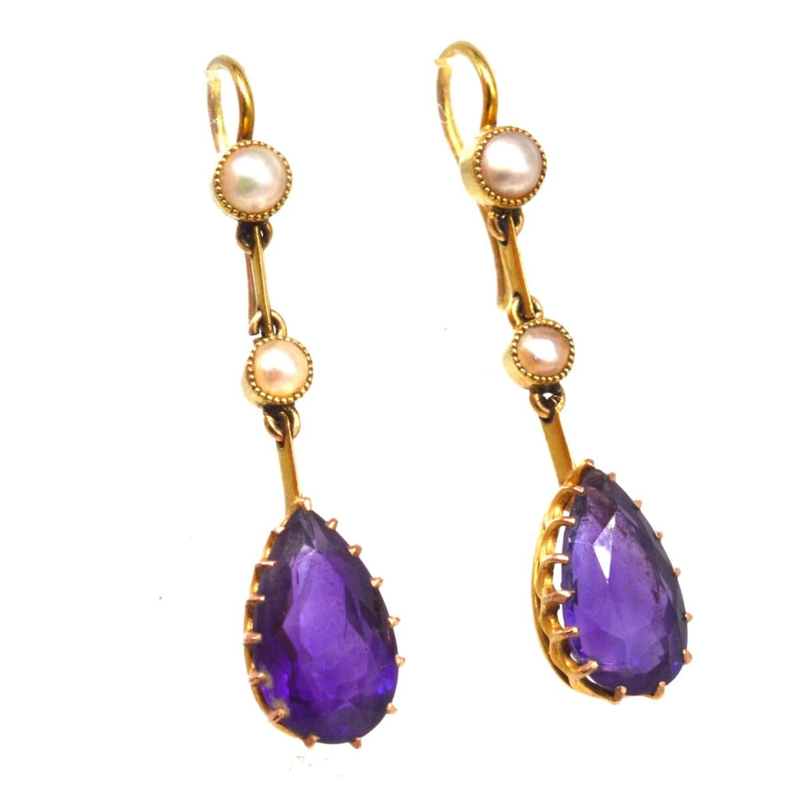 Edwardian 15ct gold drop earrings featuring pear-shaped amethyst and split pearls, elegant vintage jewelry.