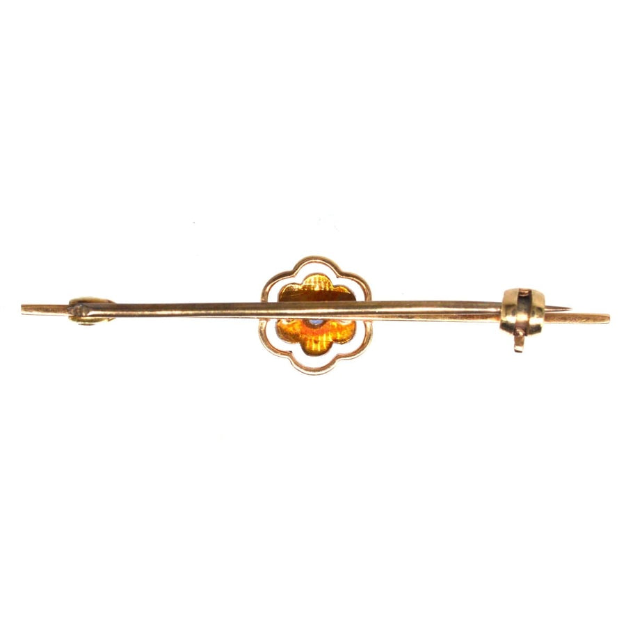 Edwardian 15ct gold and platinum bar brooch featuring a sapphire and pearl cluster flower design.