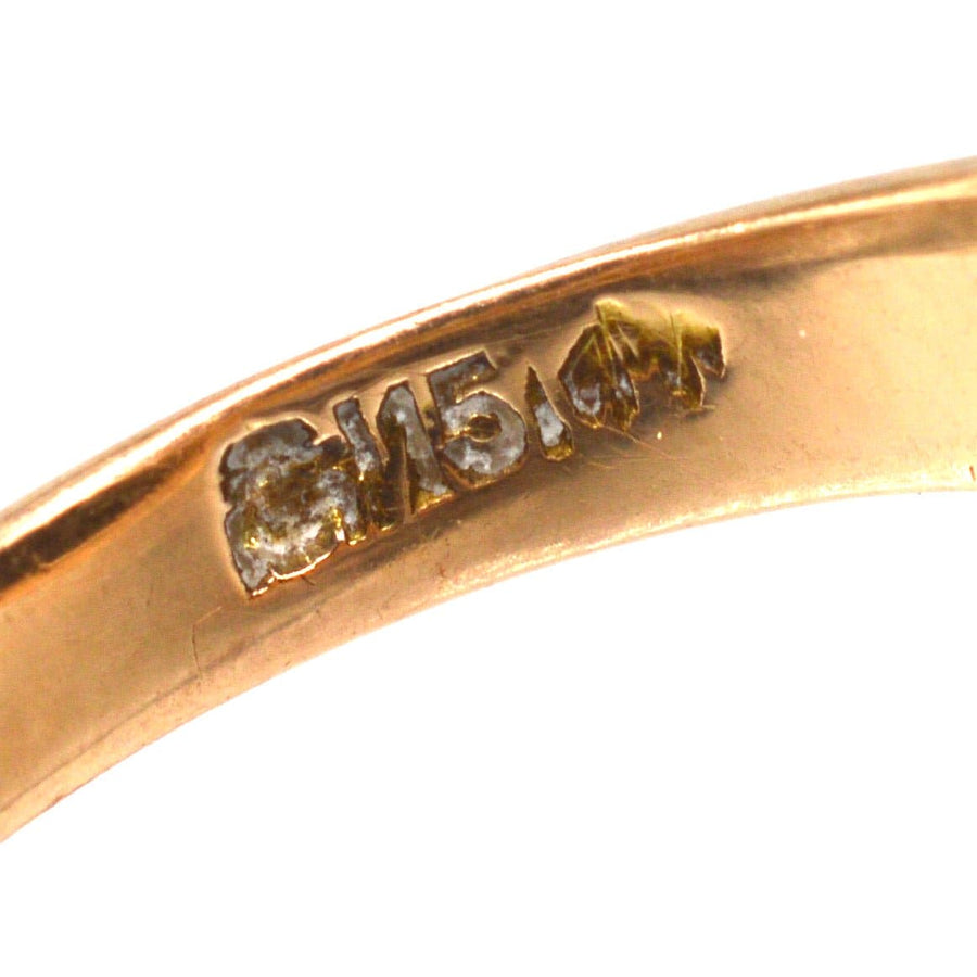 Close-up of the hallmark on an Edwardian 15ct Gold ring, showcasing the quality and authenticity of the jewelry.