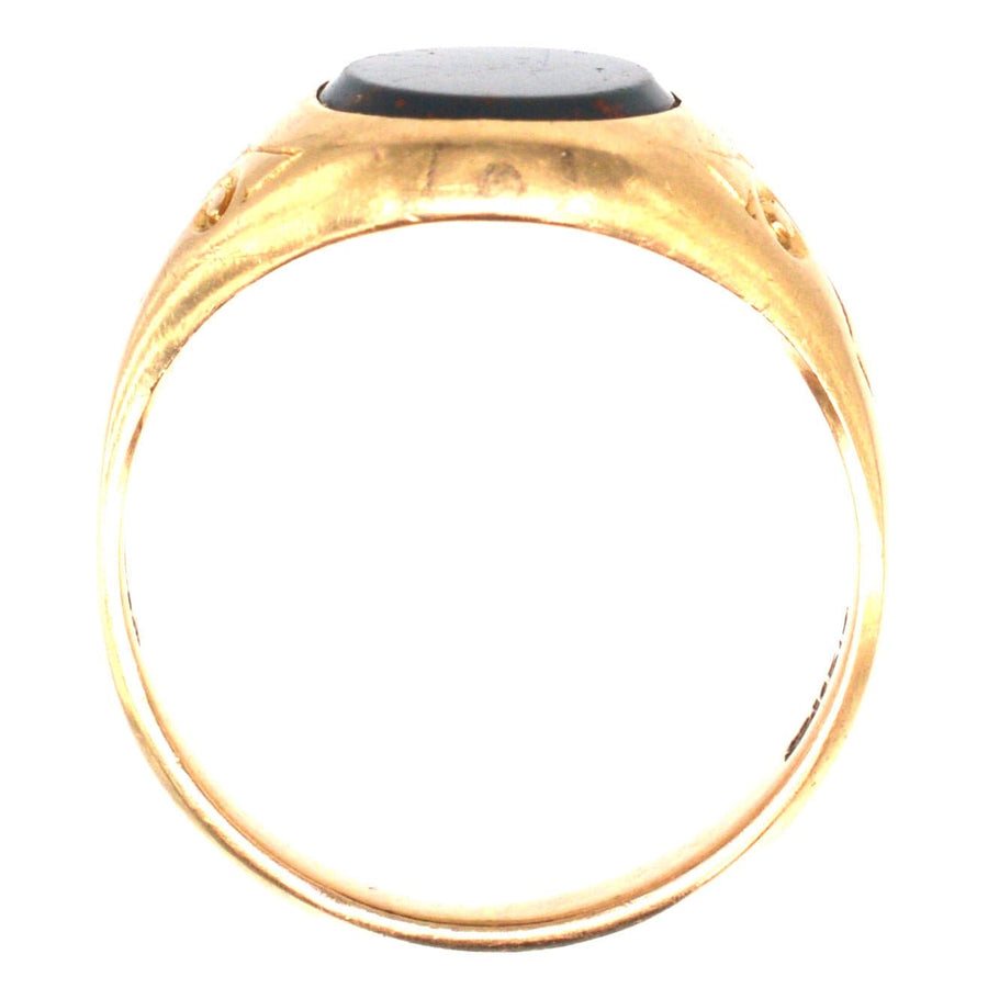 Edwardian 15ct gold bloodstone signet ring showcasing intricate design, perfect for engraving or as a unique jewelry piece.