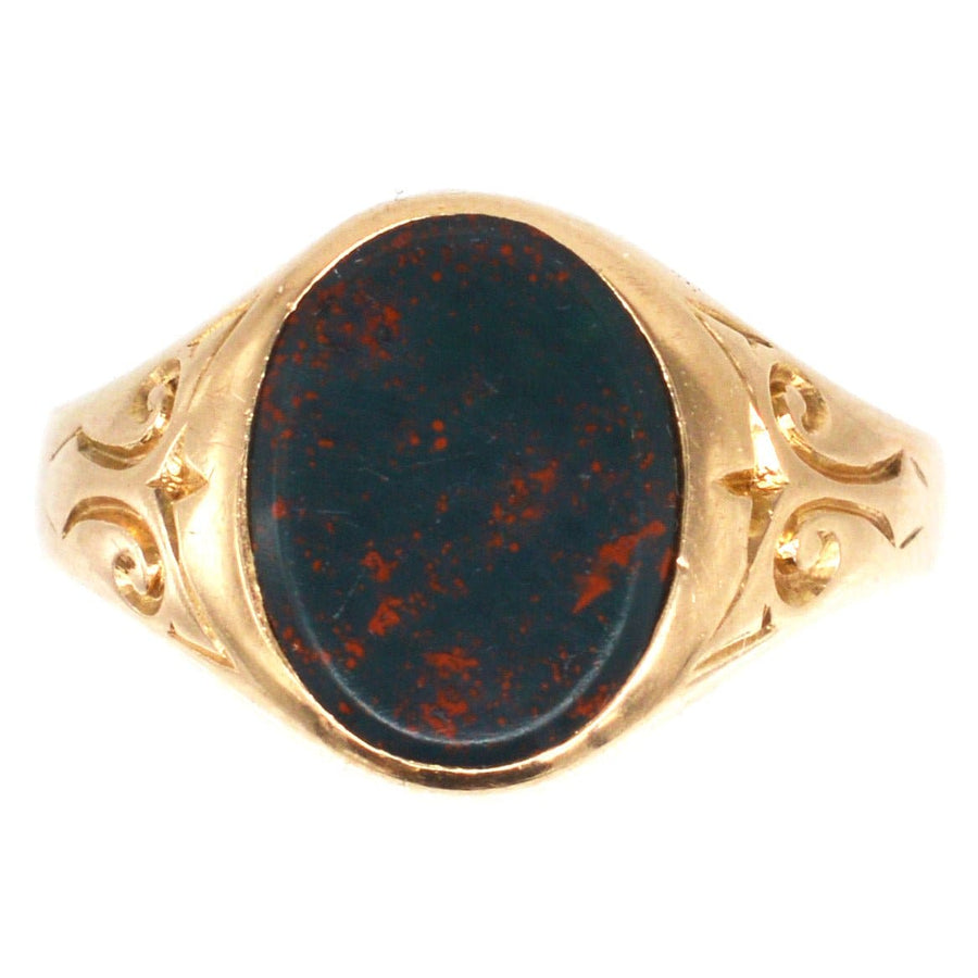 Edwardian 15ct gold bloodstone signet ring, featuring intricate engraving and a deep green bloodstone centerpiece.