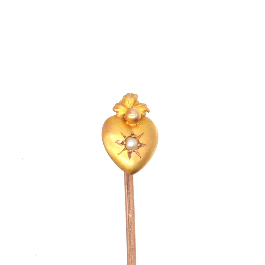 Edwardian 15ct gold burning heart tie pin with pearl, symbolizing love and passion, dating from around 1900.