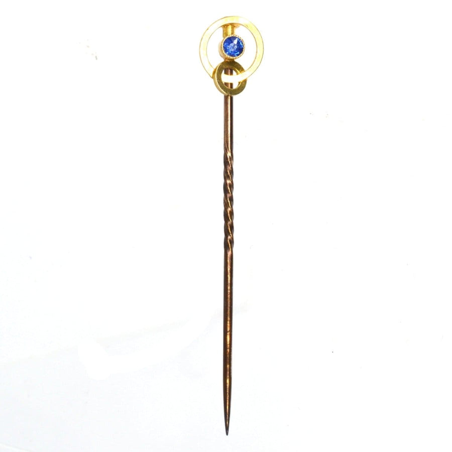 Edwardian 15ct gold double circle tie pin with sapphire, circa 1900-1910, elegant lapel accessory.