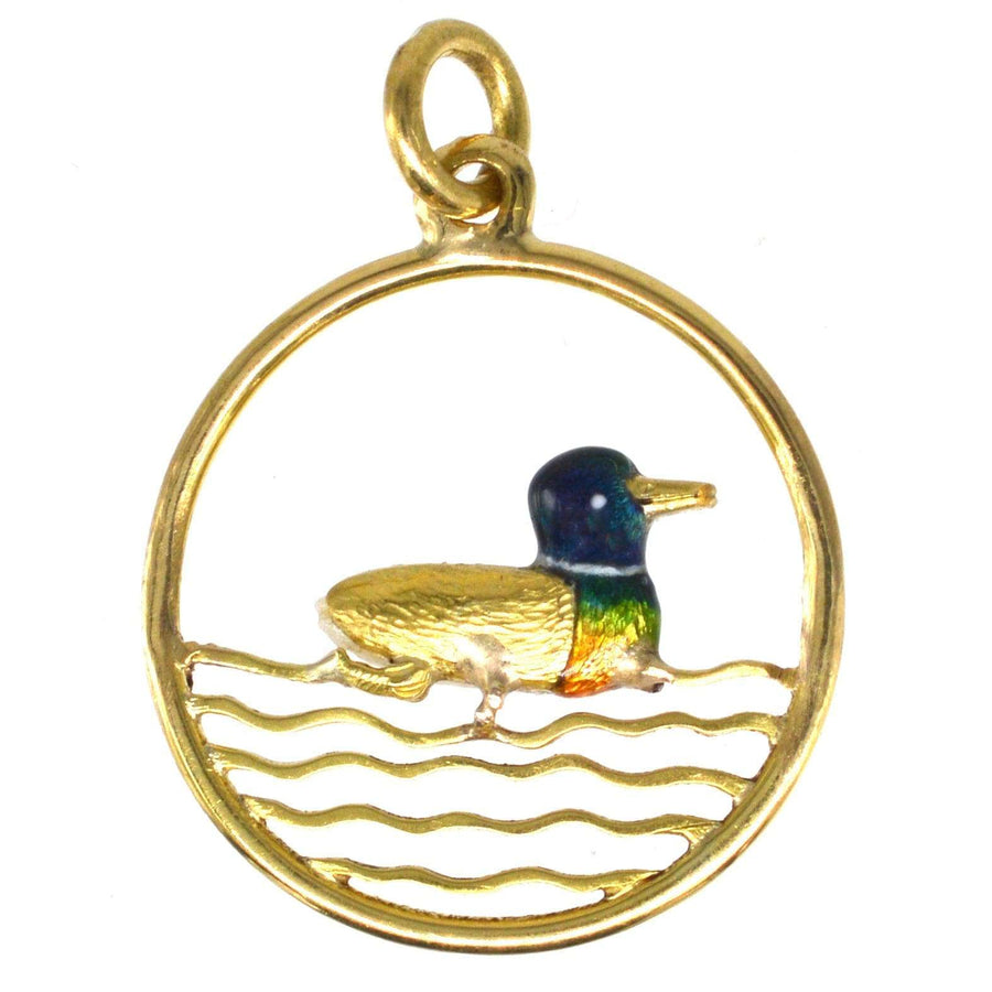 Edwardian 15ct gold duck pendant with baroque pearl and enamel details in a round frame.