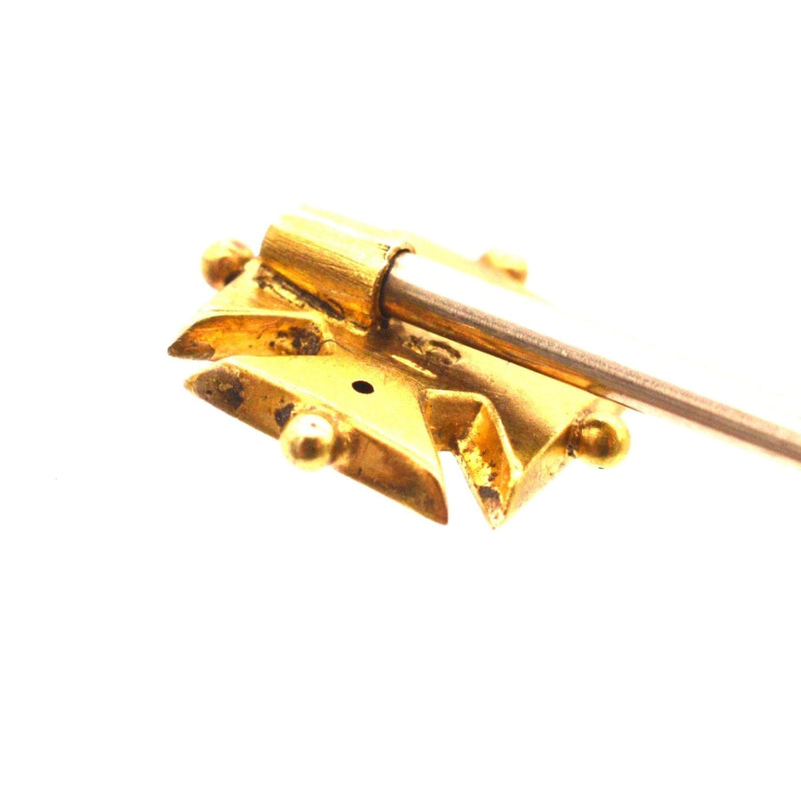 Edwardian 15ct gold Maltese cross tie pin with ruby, showcasing intricate design and craftsmanship.
