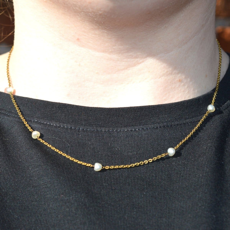 15ct gold chain necklace with natural pearls, showcasing timeless Edwardian elegance worn on a black shirt.