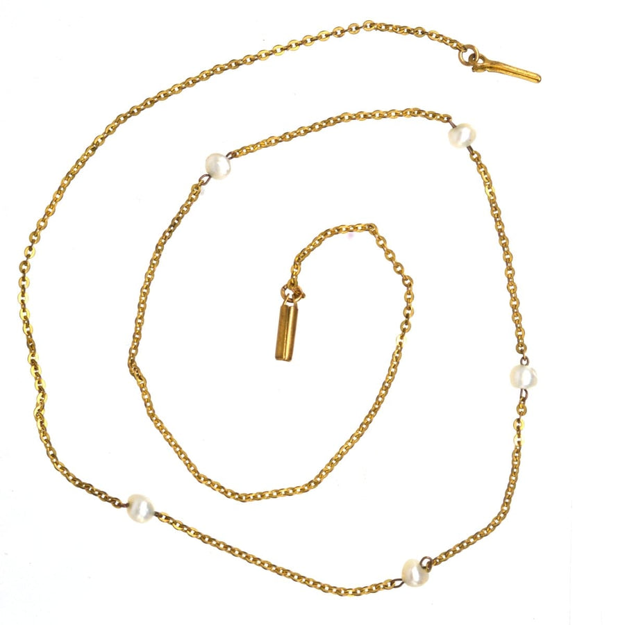 Edwardian 15ct gold chain necklace featuring five natural pearls, showcasing timeless elegance from the early 1900s.