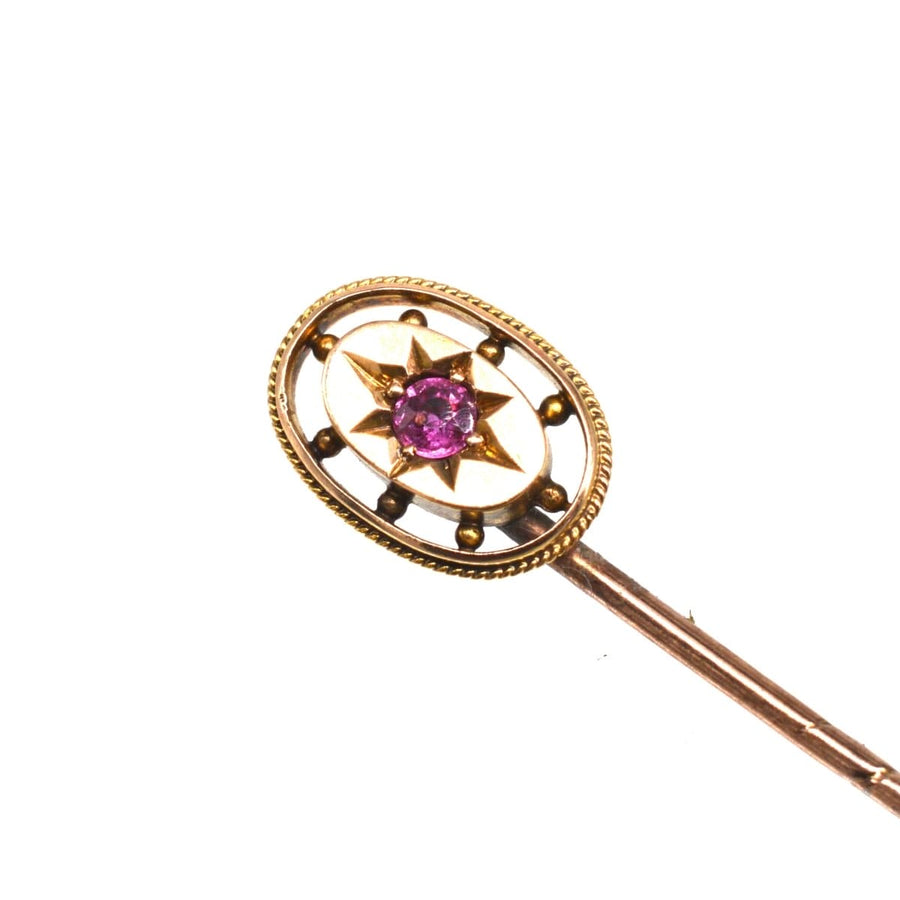 Edwardian 15ct gold oval ruby star tie pin with natural ruby and gold stone balls, perfect for special occasions.