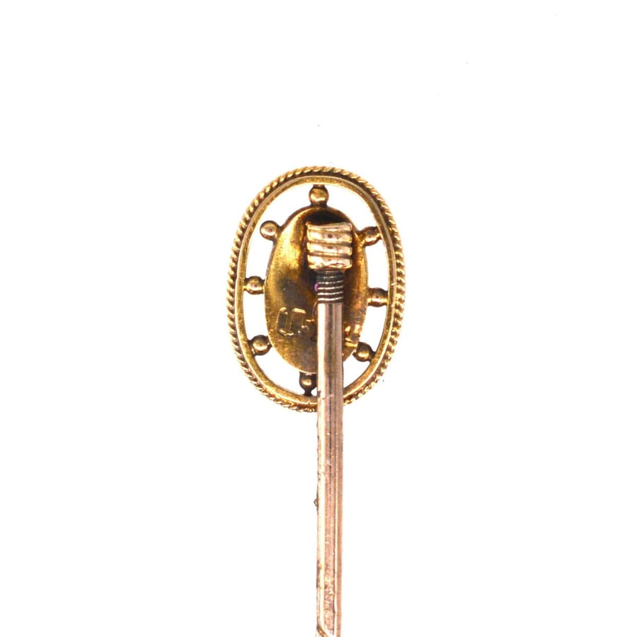 Edwardian 15ct gold oval ruby star tie pin featuring a natural ruby and gold rope frame, ideal for July birthdays.