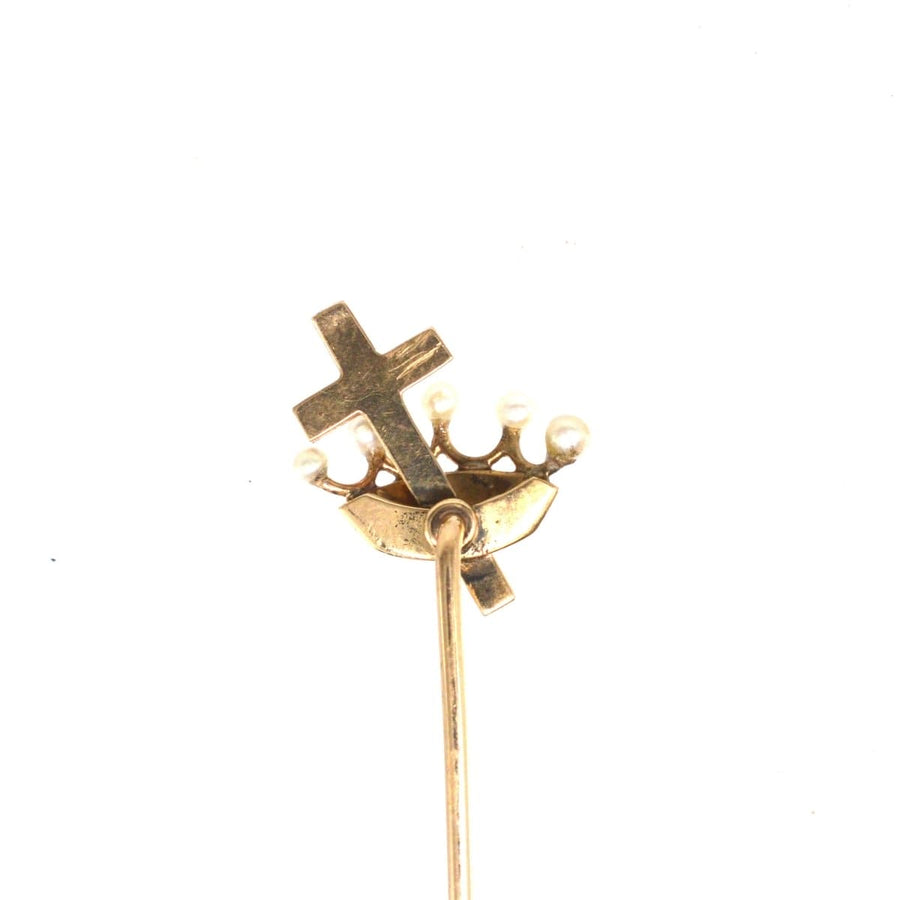 15ct gold tie pin featuring a cross and crown design adorned with seed pearls, symbolizing Christian heritage.