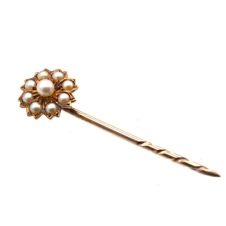 Edwardian 15ct gold flower tie pin set with natural split pearls, perfect for lapels or hats.