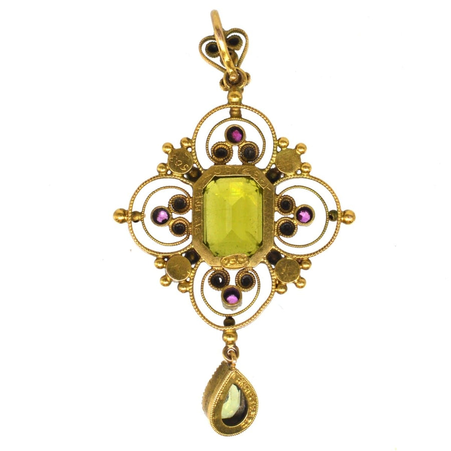 Edwardian 15ct gold Suffragette pendant with peridot, pearls, and rubies, showcasing exquisite craftsmanship.