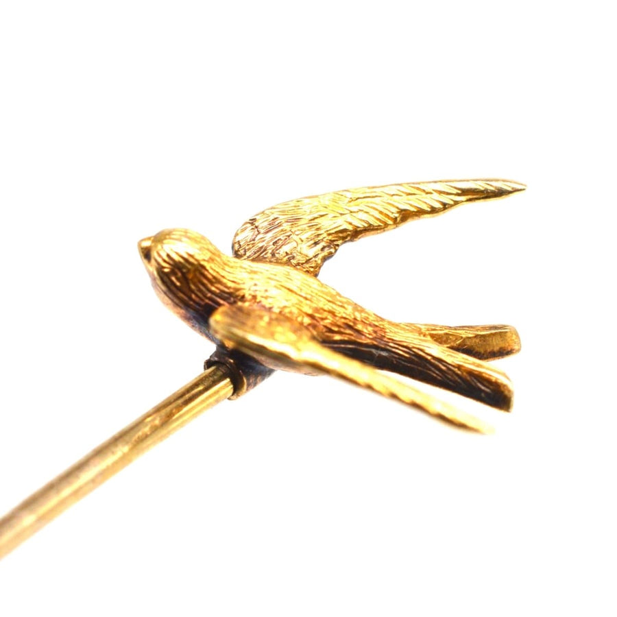 15ct gold swallow bird tie pin symbolizing love and loyalty, showcasing intricate details and vintage elegance.