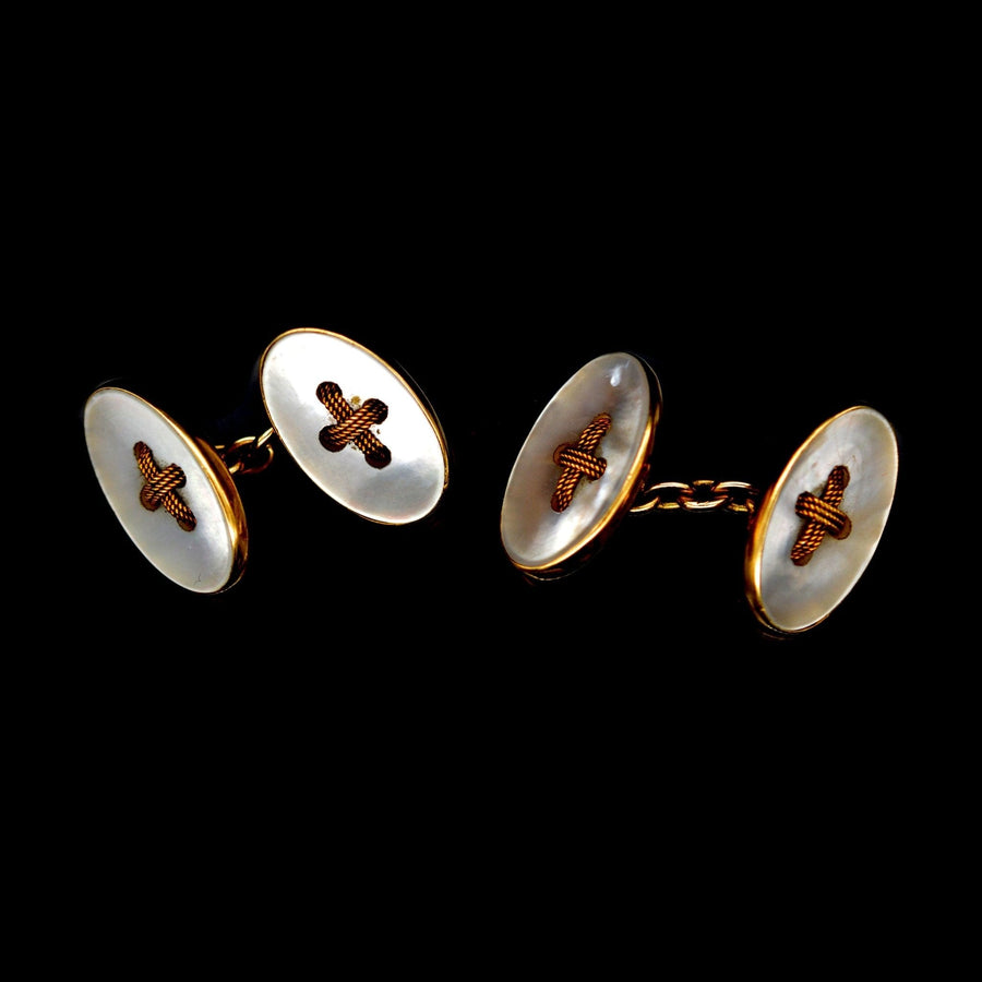 Elegant Edwardian 18ct gold and mother of pearl oval button cufflinks, featuring a simple design and luxurious finish.