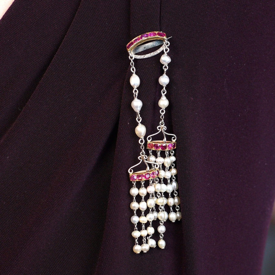 Edwardian brooch with Burma rubies, natural pearls, and rose diamonds in a double drop design.