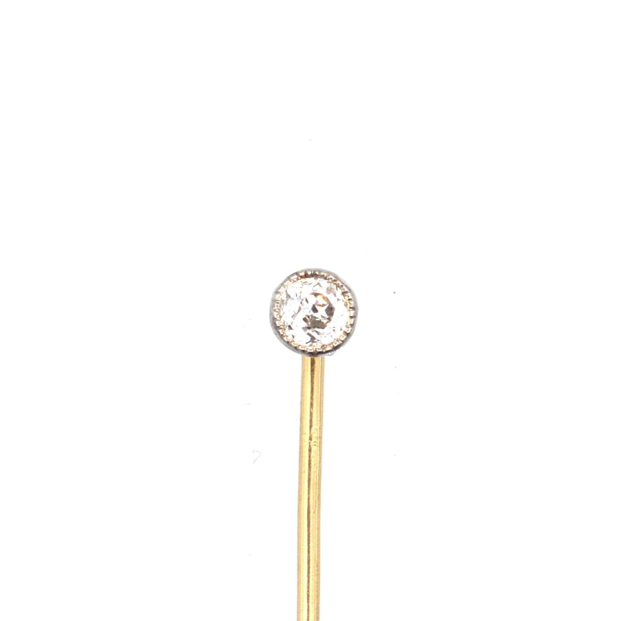 Edwardian 18ct gold and platinum single diamond tie pin featuring an old European cut diamond with a simple design.
