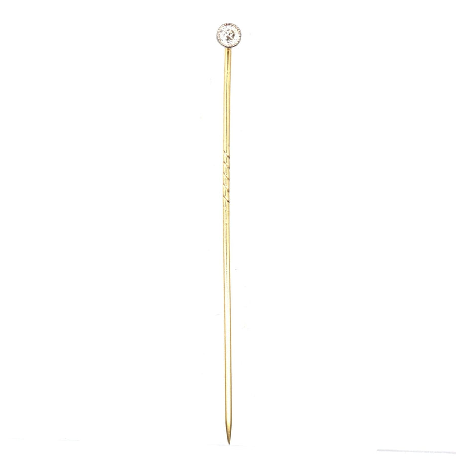 Edwardian 18ct gold and platinum single diamond tie pin featuring an old European cut diamond.