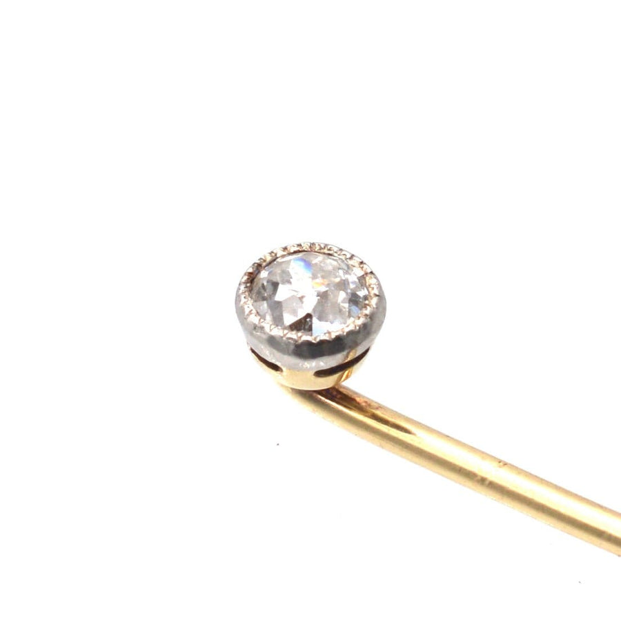 Edwardian 18ct gold and platinum tie pin featuring a single sparkling old European cut diamond.
