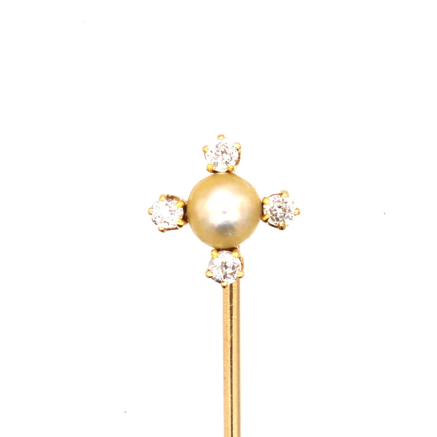 Edwardian 18ct gold tie pin featuring a natural pearl and four sparkling diamonds, perfect for ties and lapels.