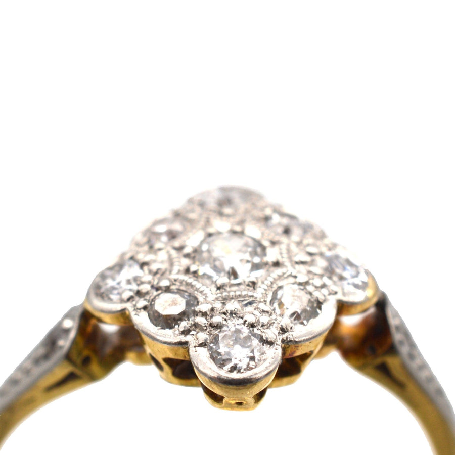 Edwardian diamond cluster ring in 18ct gold and platinum with diamond-shaped design from the 1910s.