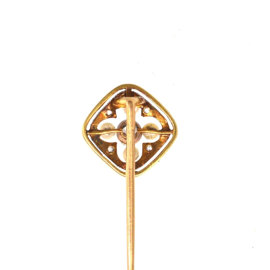 Edwardian 18ct gold and platinum tie pin with pearl and diamond quatrefoil design.