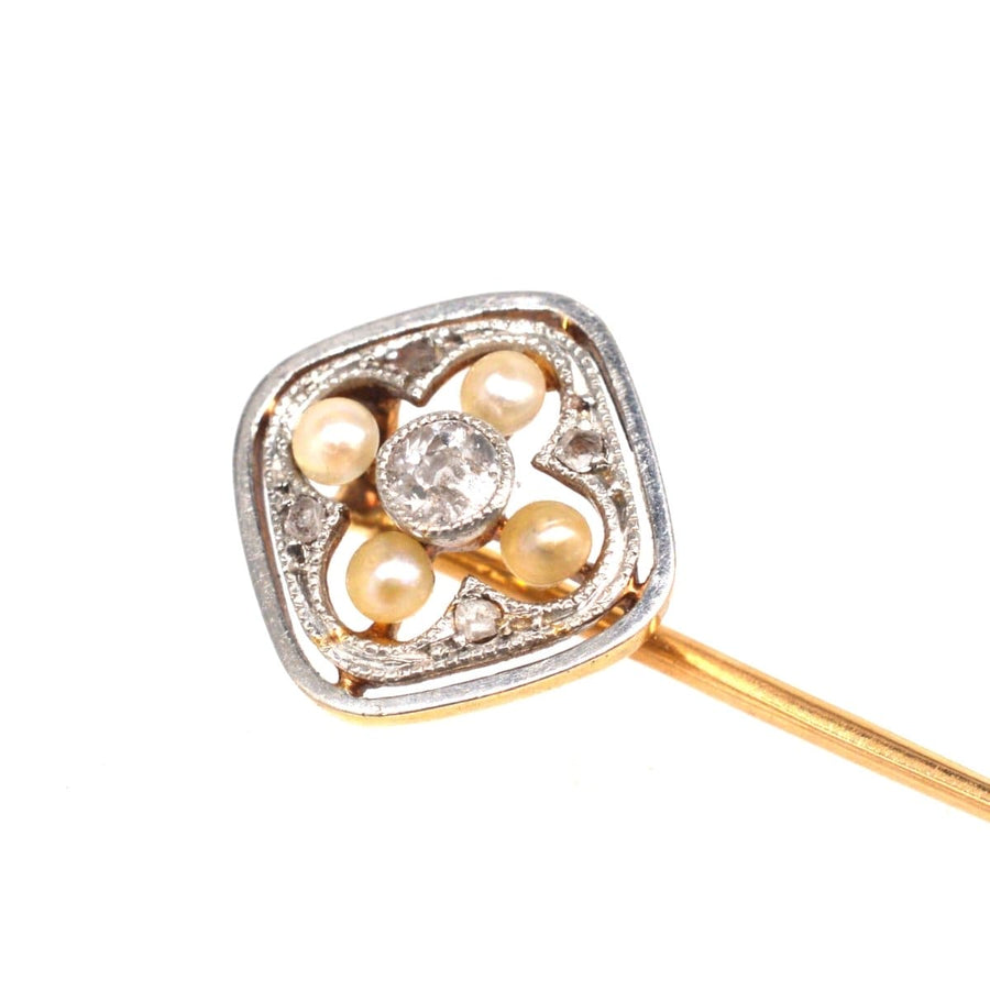 Edwardian 18ct gold and platinum tie pin with pearl and diamond quatrefoil design, showcasing vintage elegance.