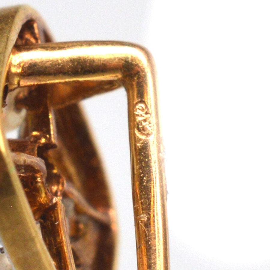 Close-up of Edwardian 18ct gold and platinum tie pin showcasing intricate craftsmanship and detailing.
