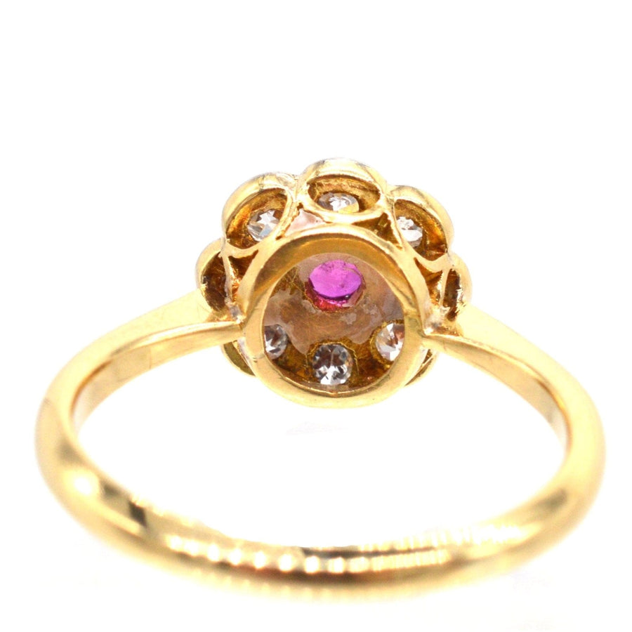 Edwardian 18ct gold and platinum ruby and diamond cluster ring from the early 1900s, ideal for engagement.