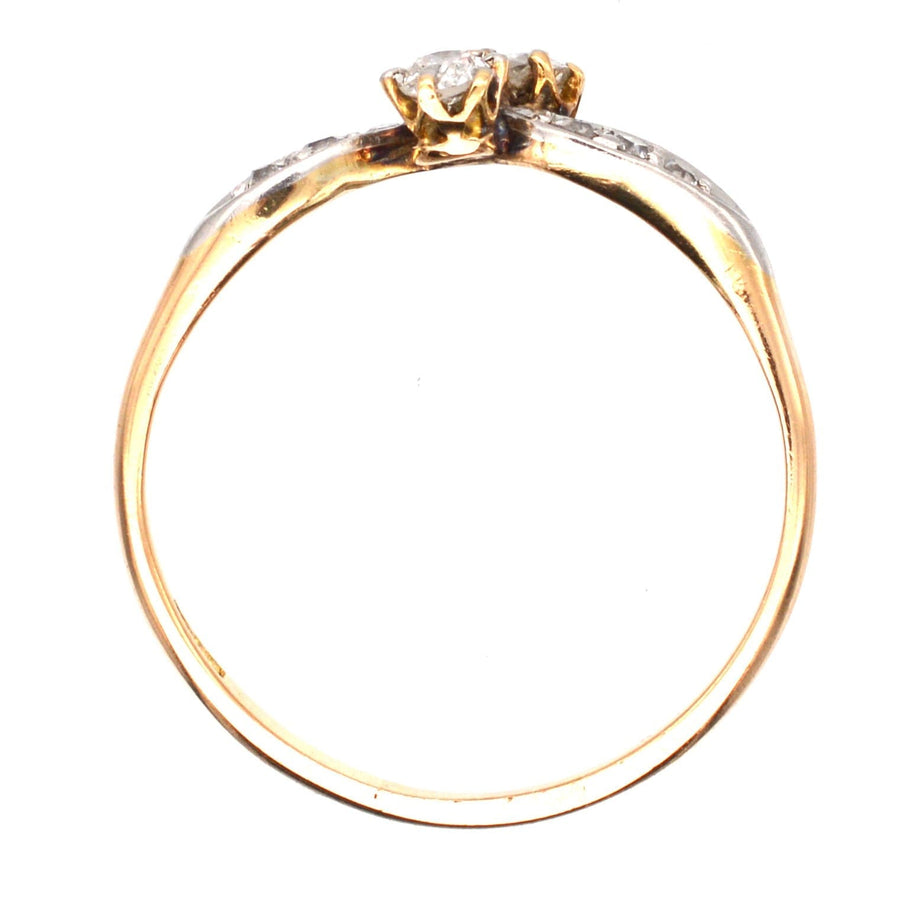 Edwardian 18ct gold and platinum two stone diamond crossover ring with diamond shoulders.