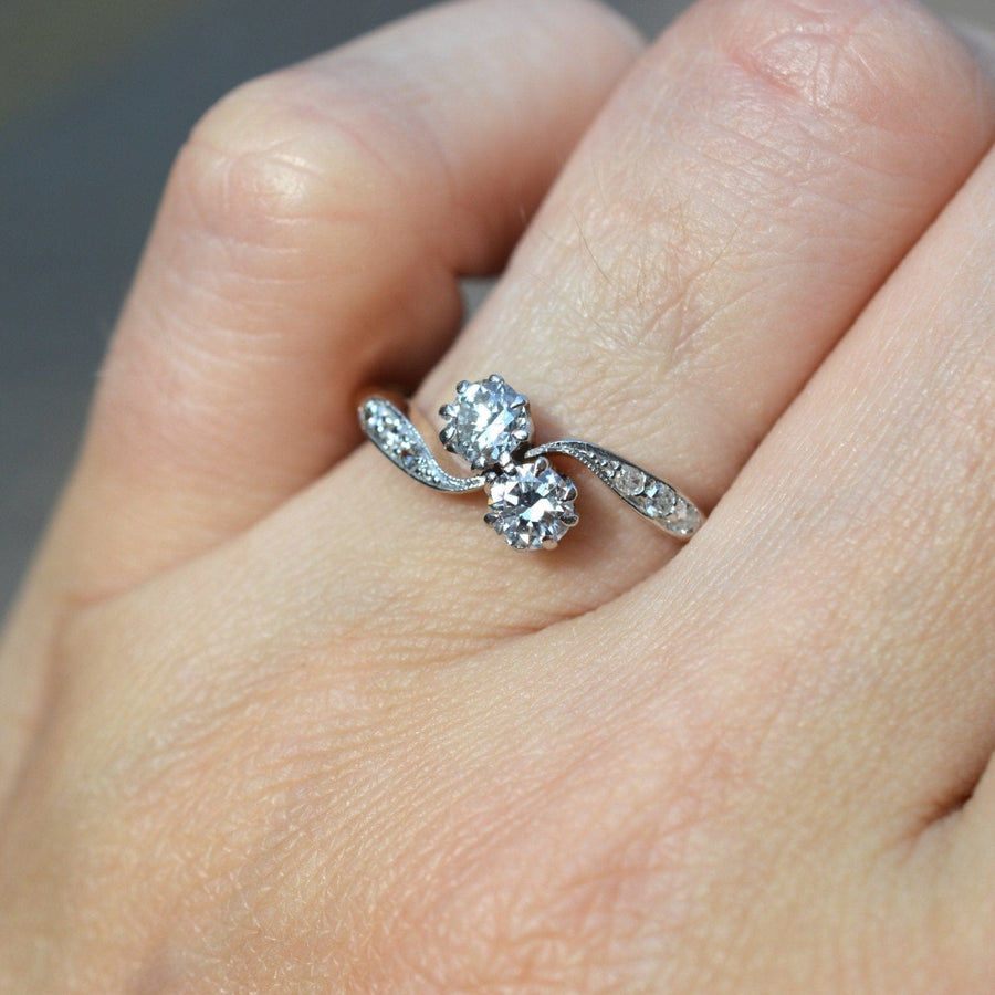 18ct gold and platinum two stone diamond 'Toi et Moi' crossover ring showcasing bright white diamonds on a hand.