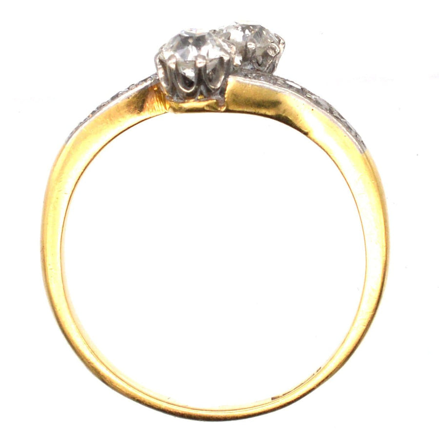 Edwardian 18ct gold and platinum two stone diamond 'Toi et Moi' crossover ring with 0.25 carat diamonds.