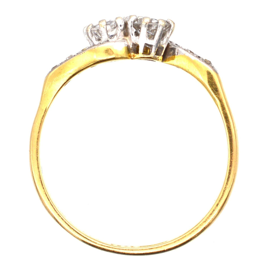 18ct gold and platinum 'Toi et Moi' crossover ring featuring two diamond shoulders, perfect for an engagement.