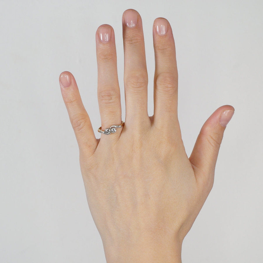Elegant Edwardian 18ct Gold & Platinum Toi et Moi crossover ring with two brilliant diamonds.