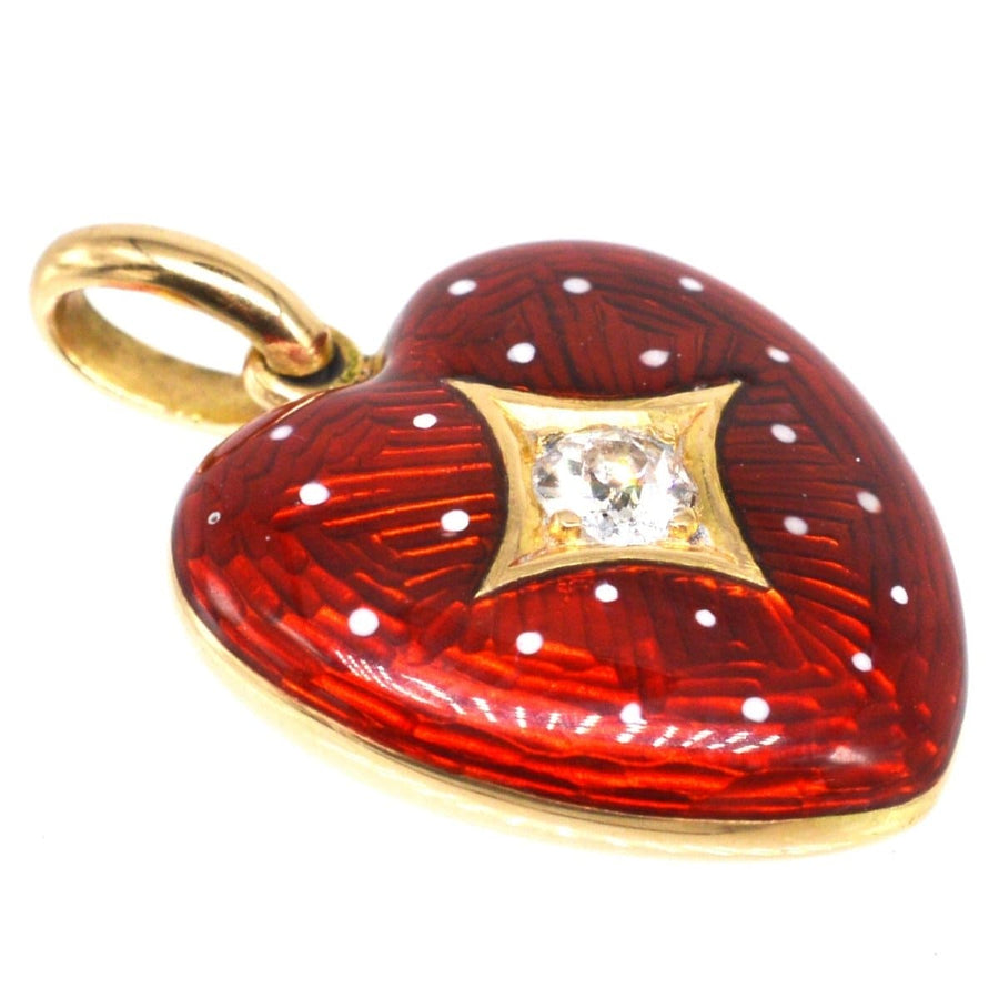 Edwardian 18ct gold heart locket with red enamel, white dots, and a sparkling diamond in gold star-setting.