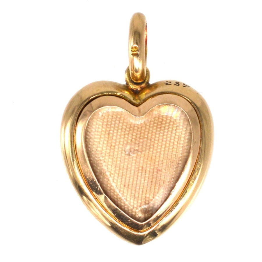 Edwardian 18ct gold heart locket, perfect for charm bracelets and necklaces, featuring space for cherished photo.
