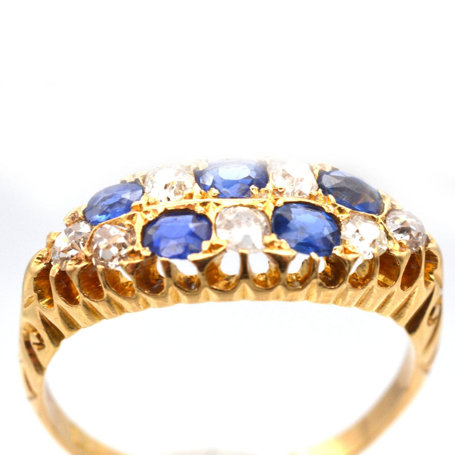 Edwardian 18ct gold chequerboard ring featuring sapphires and old mine cut diamonds, crafted in 1903.
