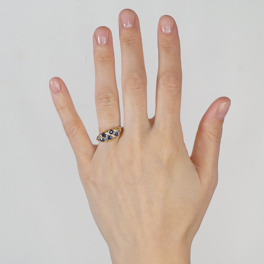 Edwardian 18ct gold chequerboard ring with sapphires and old mine cut diamonds worn on hand.