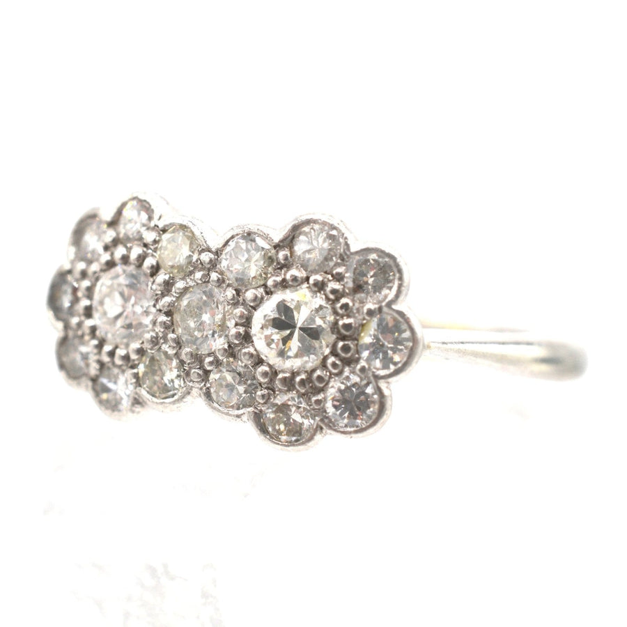 Stunning Edwardian 18ct white gold and platinum double cluster diamond ring, featuring sparkling well-matched diamonds.