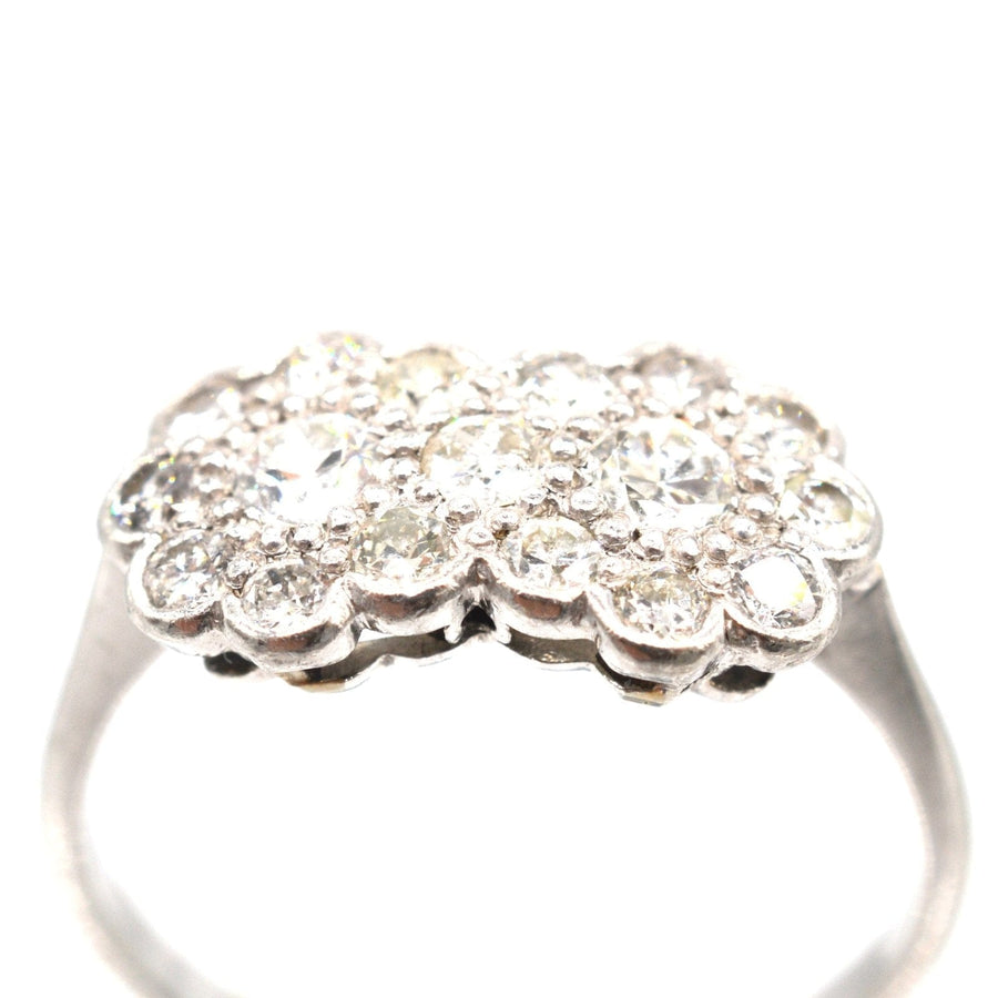 Sparkling Edwardian 18ct white gold and platinum double cluster diamond ring with well-matched stones.