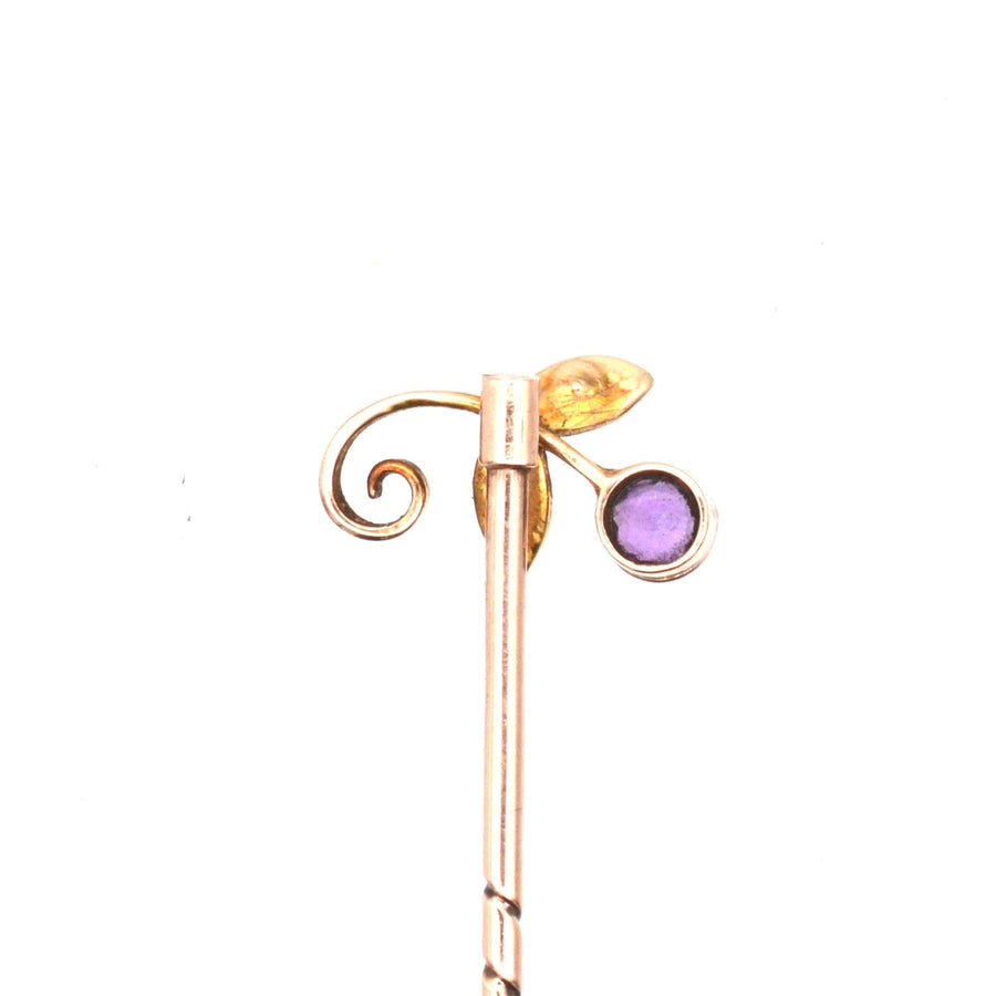 Edwardian 9ct gold tie pin featuring amethyst and seed pearl in floral design, complete with stopper.